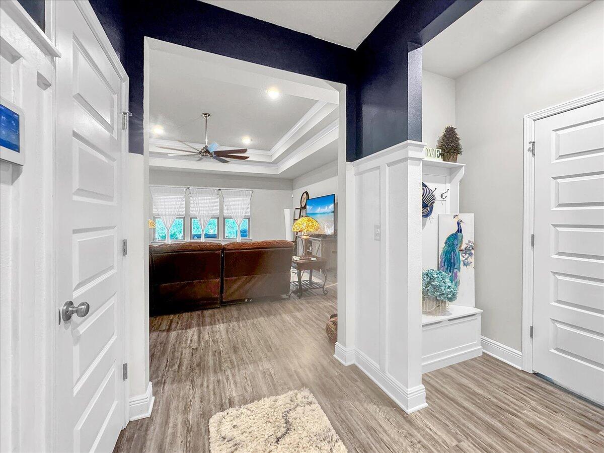 3568 Moonstone Drive Navarre, FL 32566 - Photo 3 of 39 a living room with furniture and a wooden floor