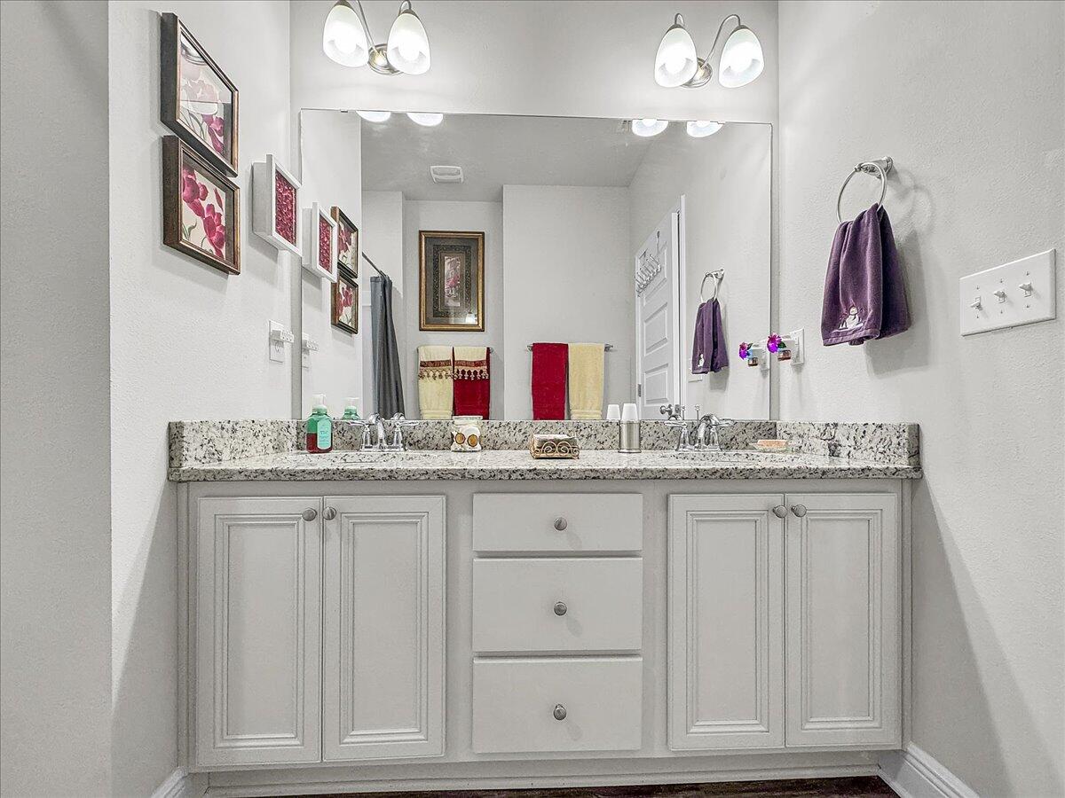 3568 Moonstone Drive Navarre, FL 32566 - Photo 32 of 39 a bathroom with sinks granite countertop and a mirror