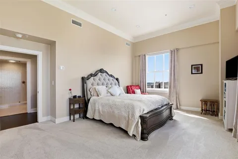 a bed room with a bed and a tv