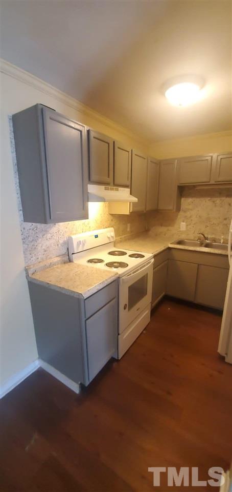 a room with stainless steel appliances granite countertop a sink and a cabinets