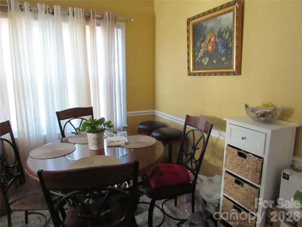a room with a refrigerator and washer