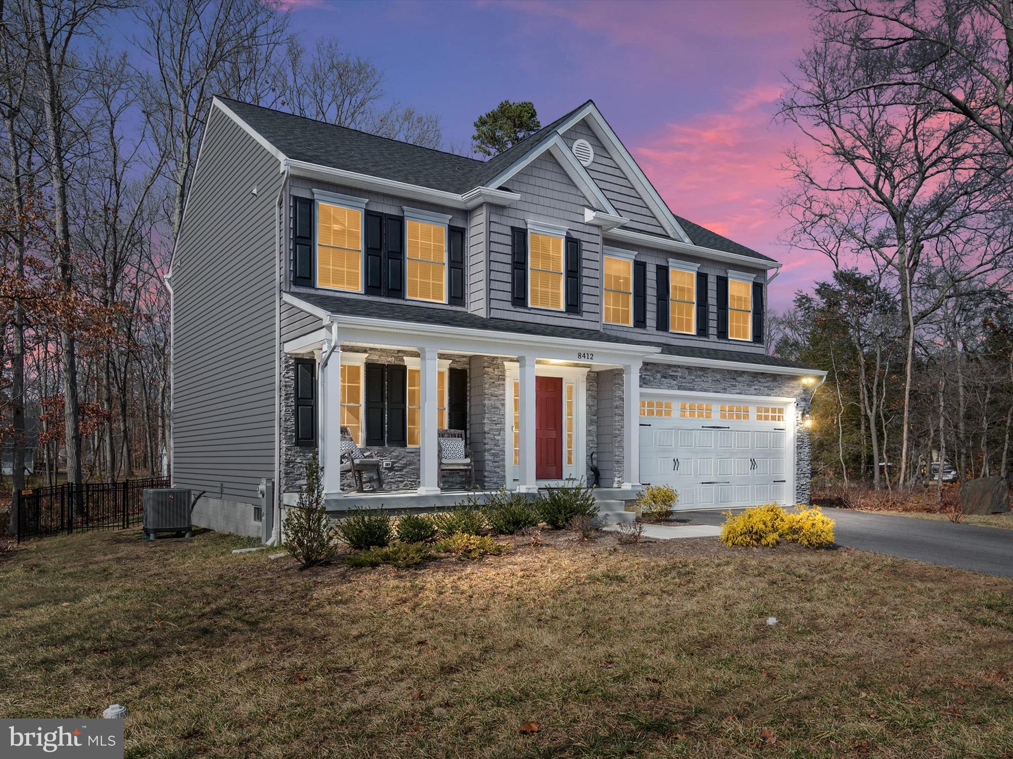 a front view of a house with large yard