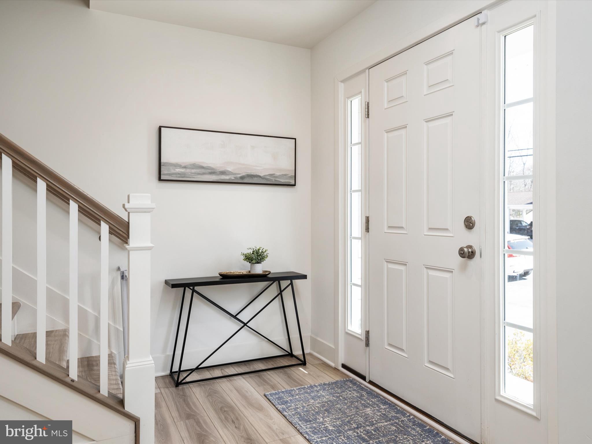 8412 Maryland Road Pasadena, MD 21122 - Photo 12 of 61 a view of an entryway with wooden floor