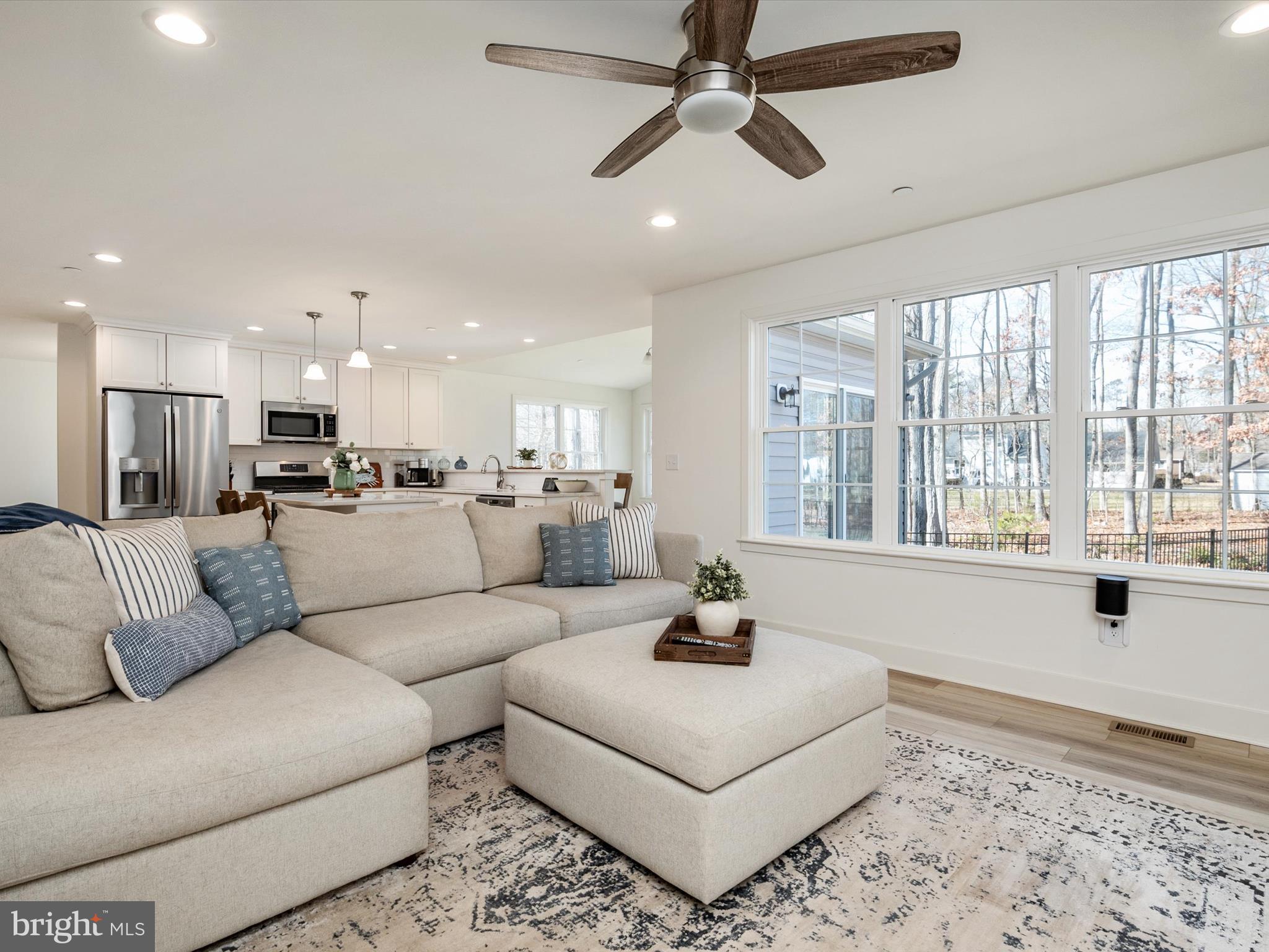 8412 Maryland Road Pasadena, MD 21122 - Photo 20 of 61 a living room with furniture and a large window