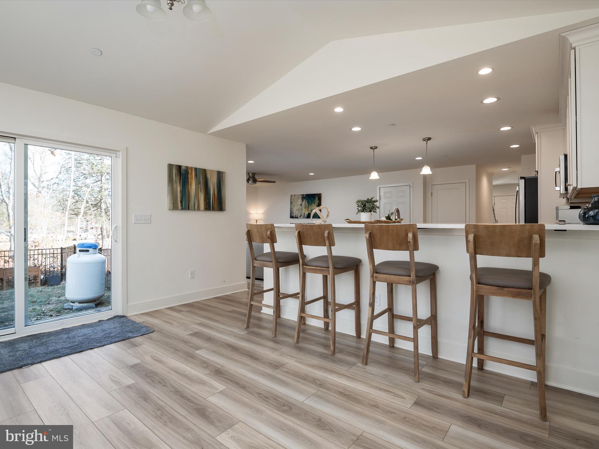 8412 Maryland Road Pasadena, MD 21122 - Photo 23 of 61 a view of a kitchen with dining room and windows