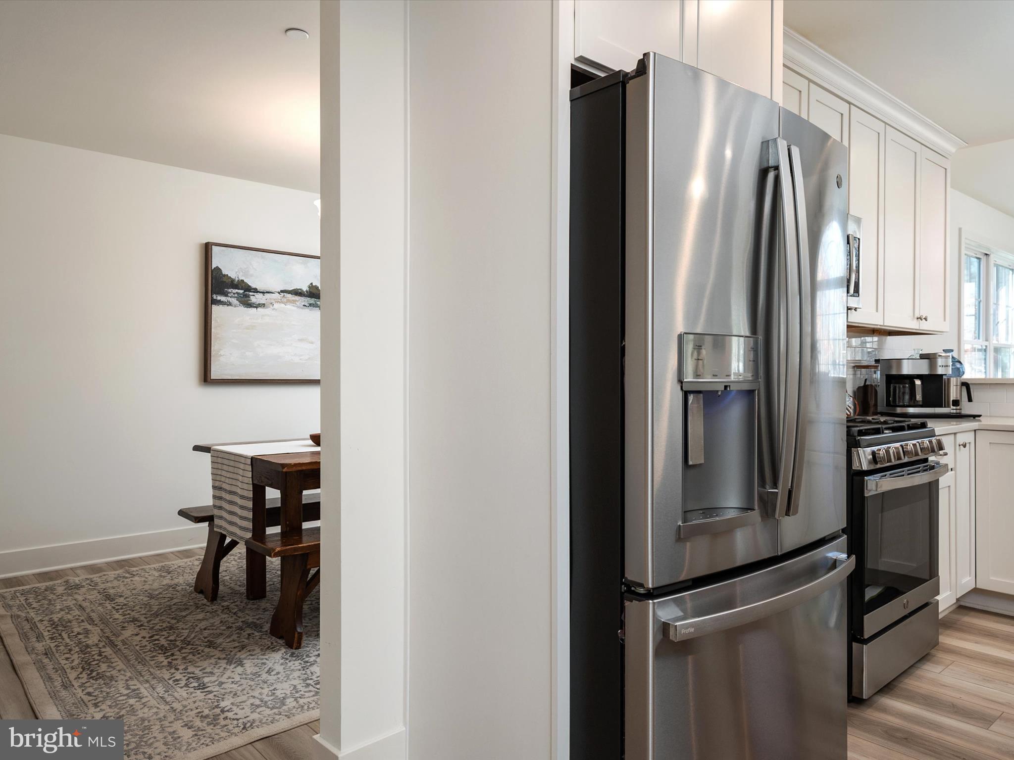 8412 Maryland Road Pasadena, MD 21122 - Photo 24 of 61 a kitchen with a refrigerator and cabinets