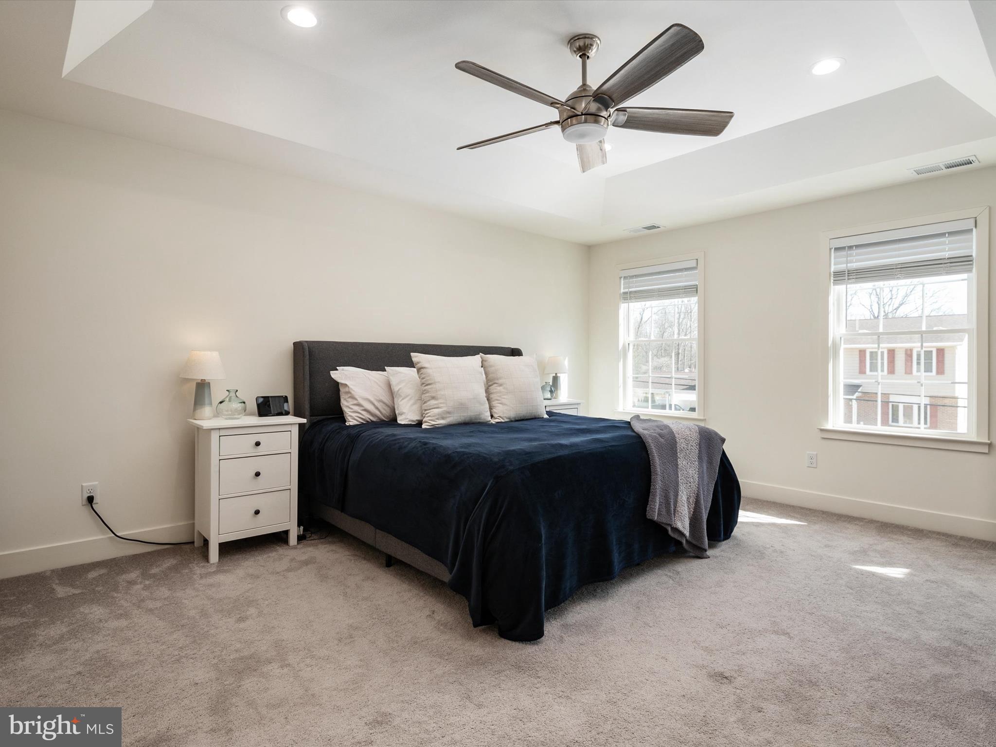 8412 Maryland Road Pasadena, MD 21122 - Photo 28 of 61 a spacious bedroom with a bed and a window