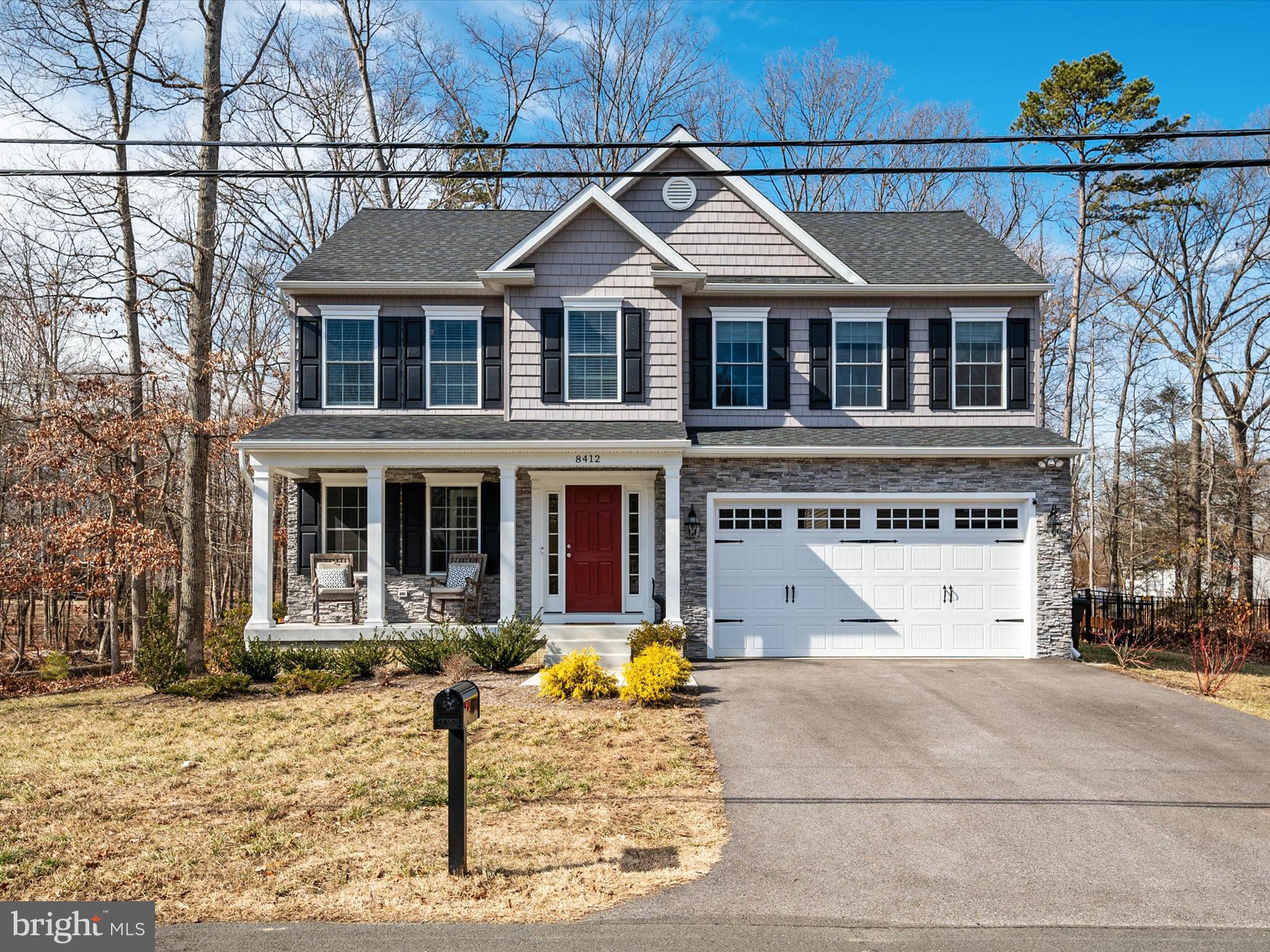 8412 Maryland Road Pasadena, MD 21122 - Photo 3 of 61 a view of a white house with large windows next to a road