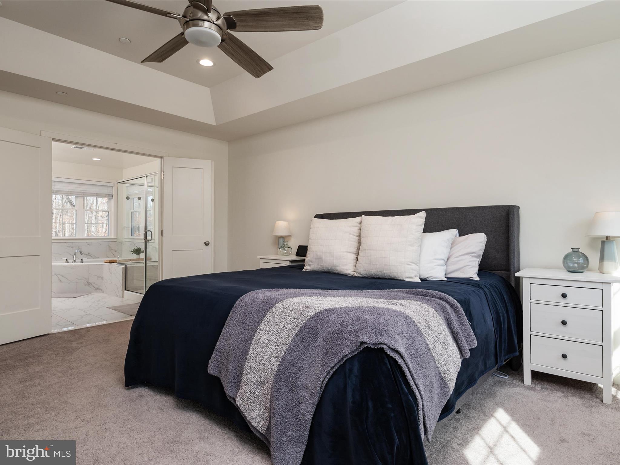 8412 Maryland Road Pasadena, MD 21122 - Photo 30 of 61 a bedroom with a bed and ceiling fan