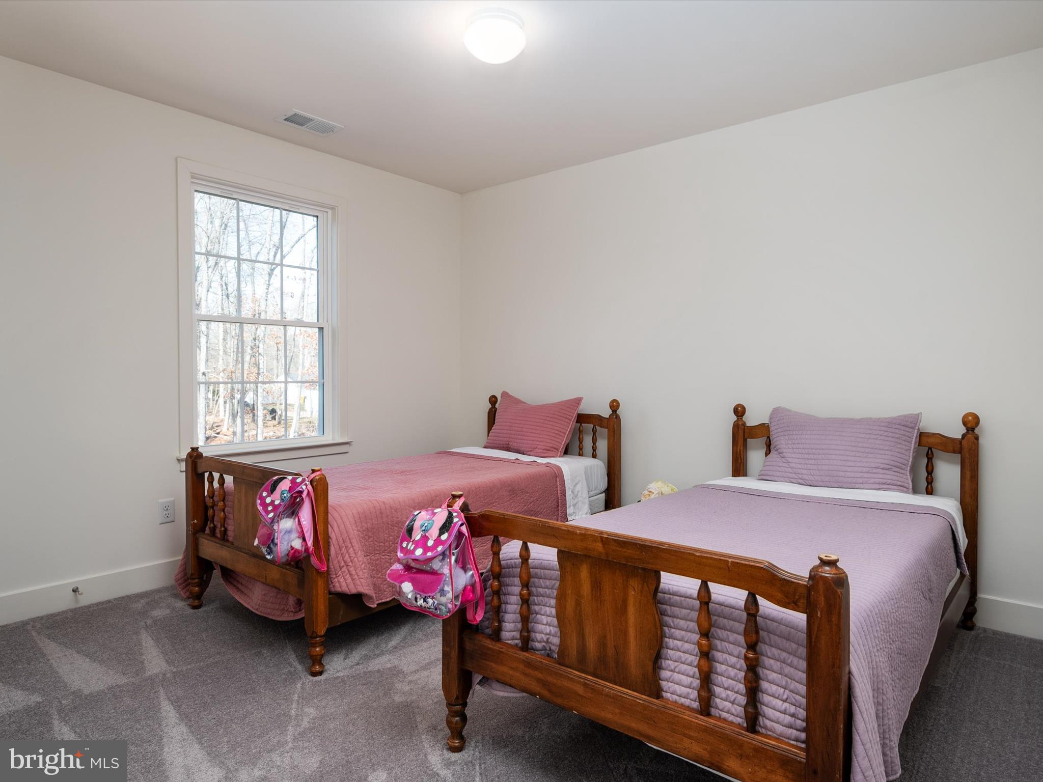 8412 Maryland Road Pasadena, MD 21122 - Photo 35 of 61 a bedroom with two beds and window