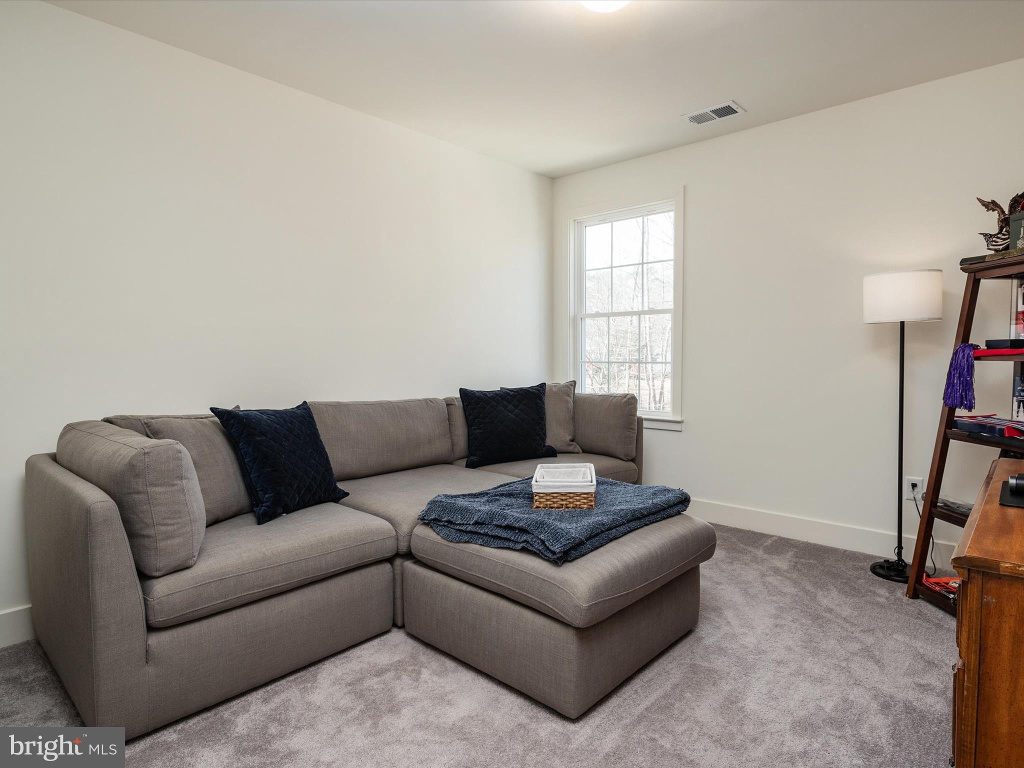 8412 Maryland Road Pasadena, MD 21122 - Photo 37 of 61 a living room with furniture and a window