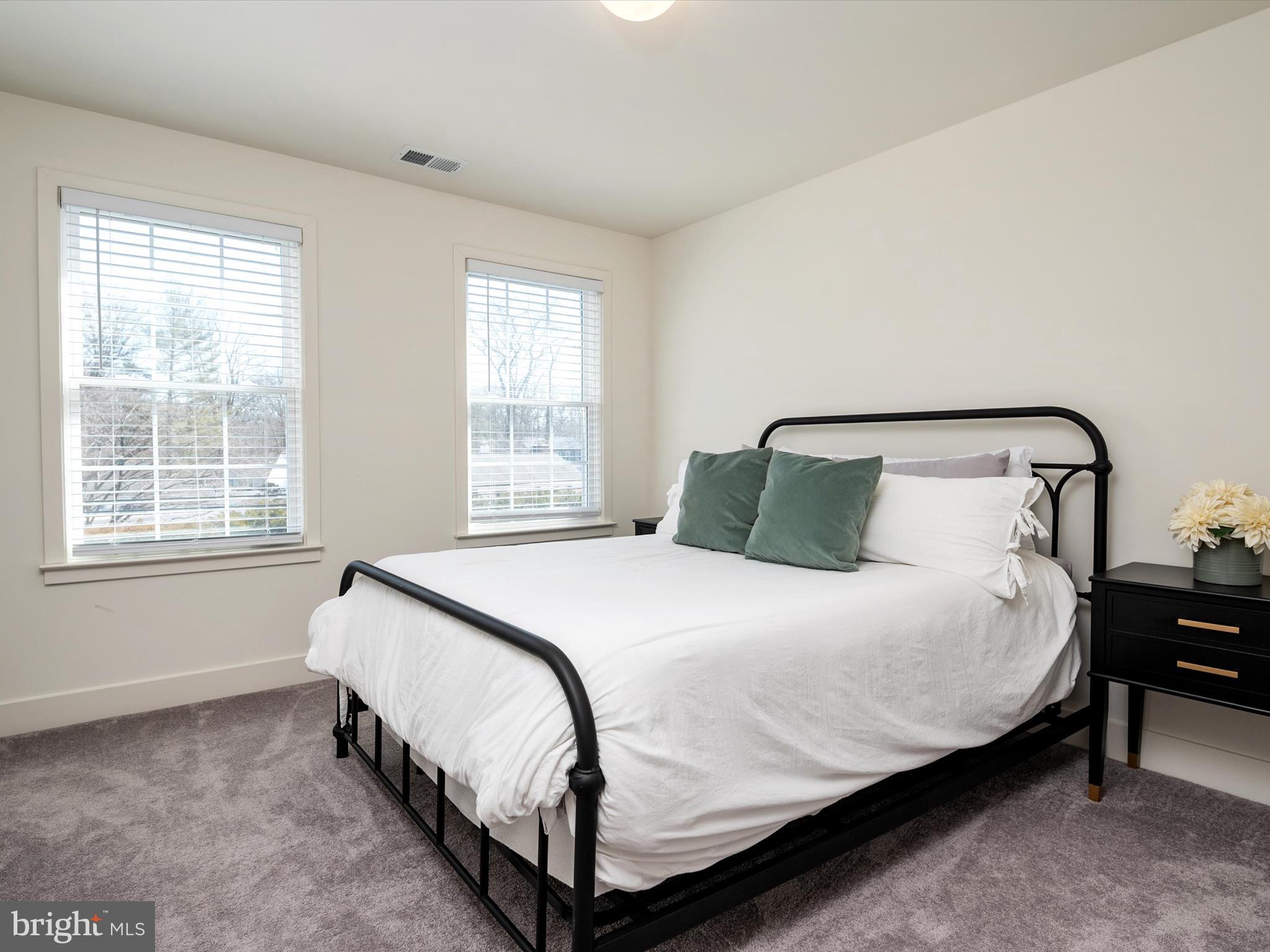 8412 Maryland Road Pasadena, MD 21122 - Photo 38 of 61 a bedroom with a bed and window