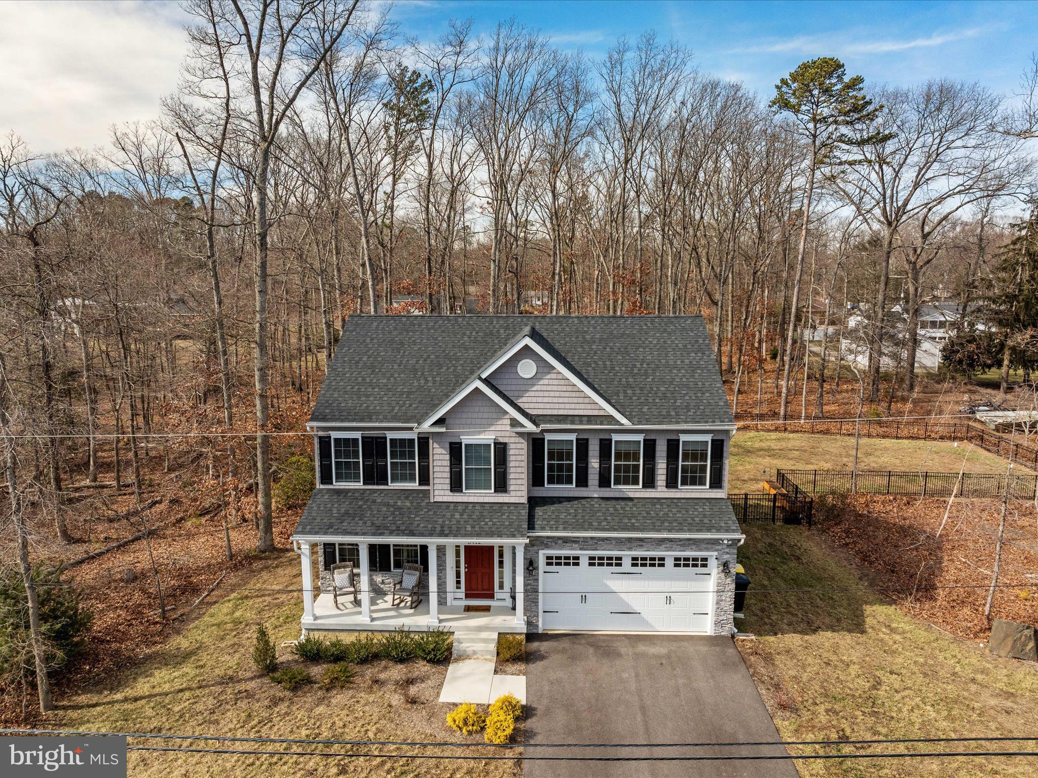8412 Maryland Road Pasadena, MD 21122 - Photo 4 of 61 front view of a house with a yard