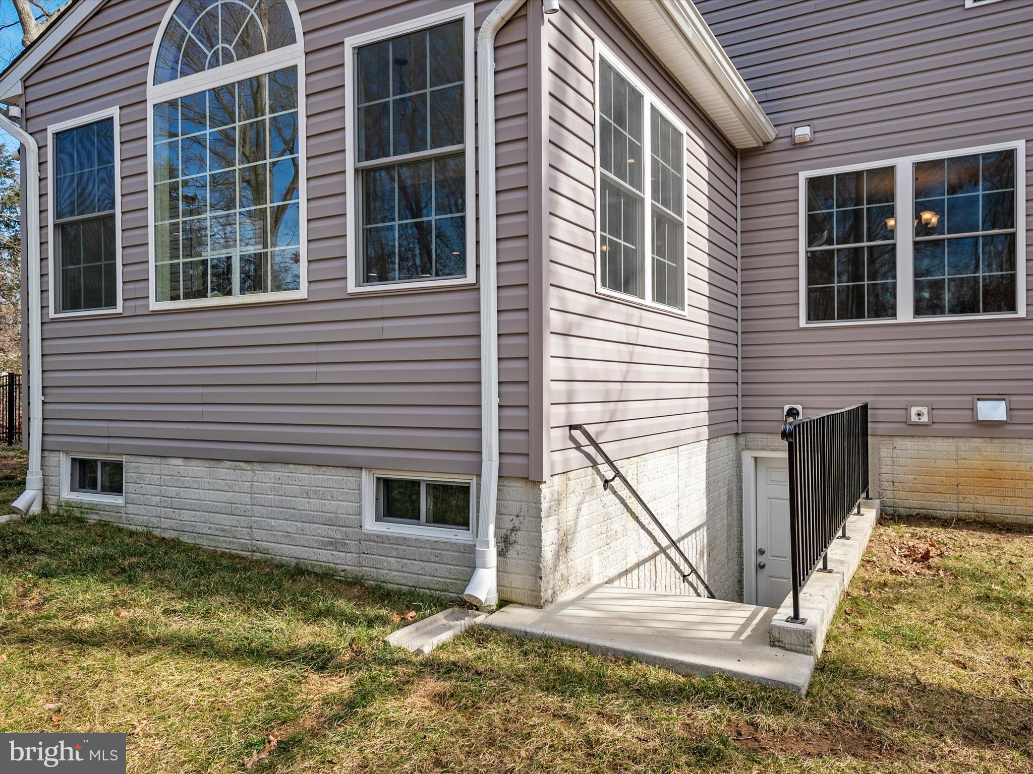 8412 Maryland Road Pasadena, MD 21122 - Photo 55 of 61 a view of front door of house with a yard