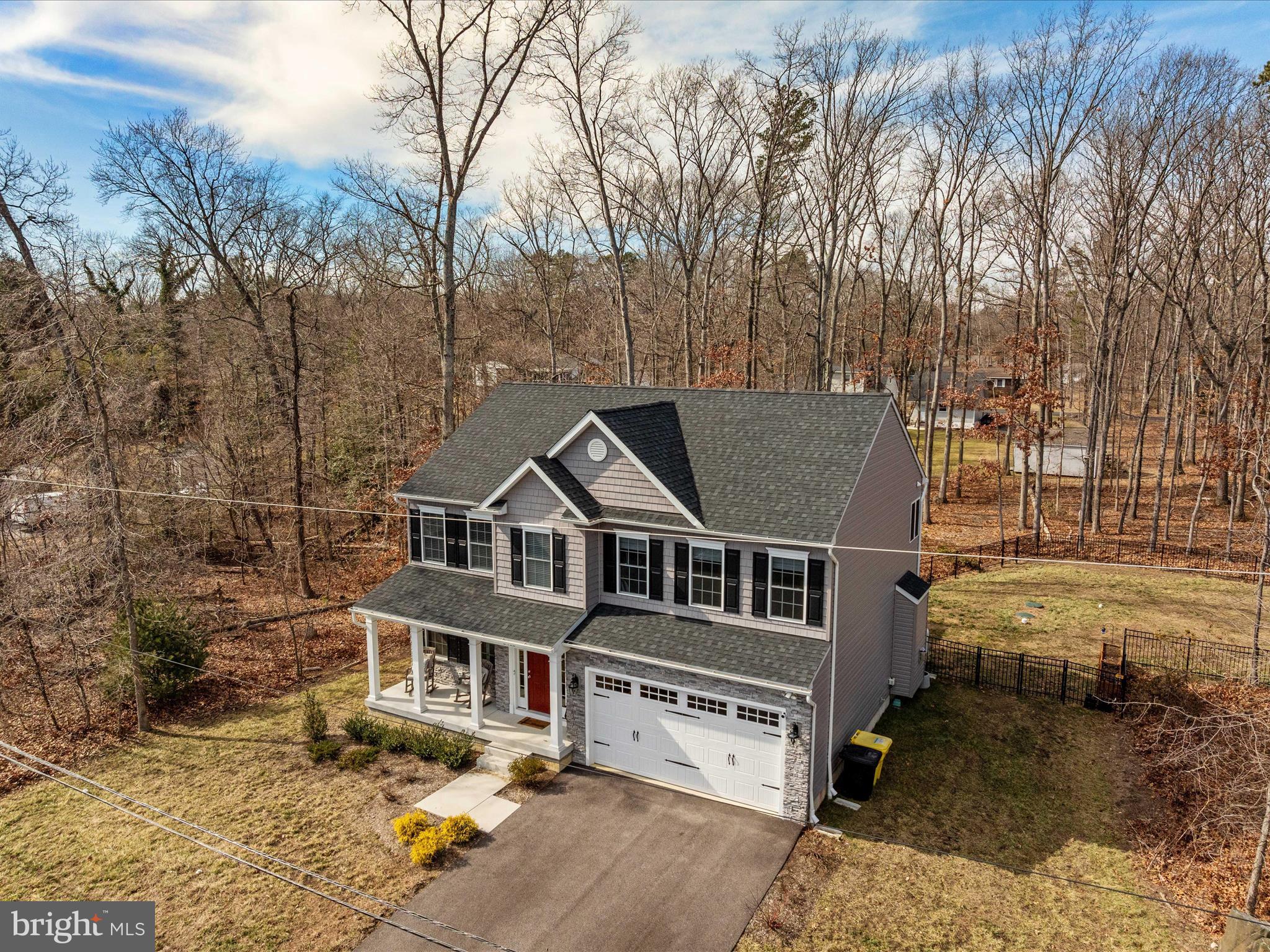 8412 Maryland Road Pasadena, MD 21122 - Photo 7 of 61 a aerial view of a house with a yard covered with snow in front of house