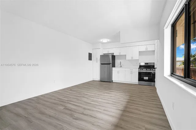 a view of kitchen with wooden floor