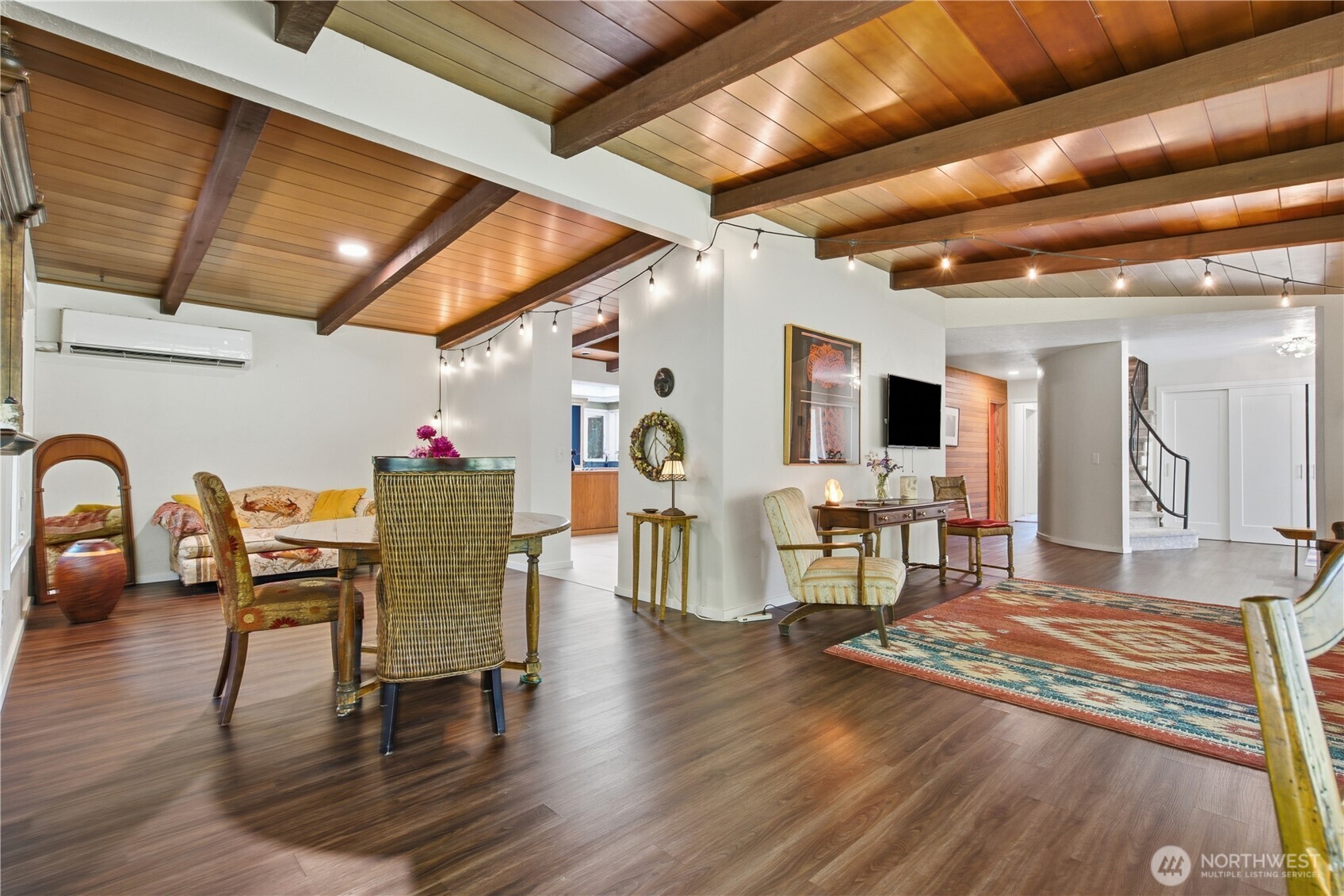 3050 Southeast Mullenix Road Port Orchard, WA 98367 - Photo 7 of 40 a dining room with furniture wooden floor and a rug