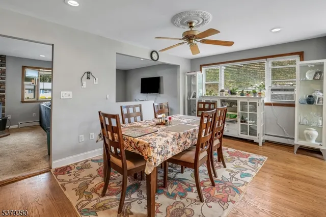 a dining room with furniture window wooden floor