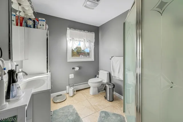 a bathroom with a toilet sink and tub