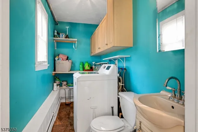 a bathroom with a sink toilet and tub
