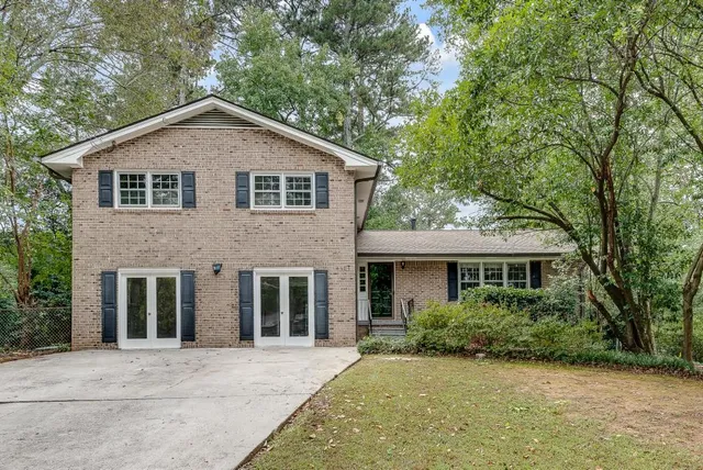 a front view of a house with a yard