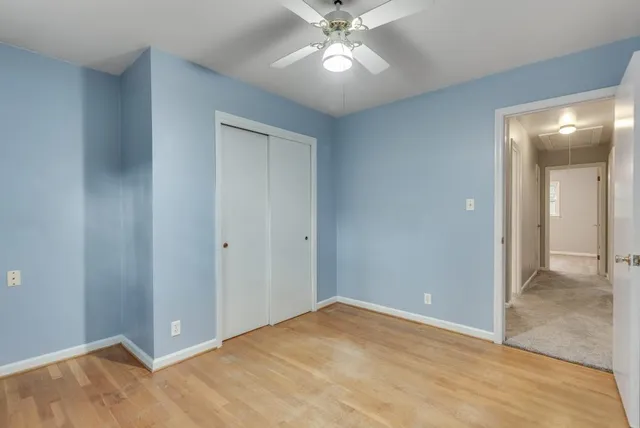 a view of an empty room and wooden floor