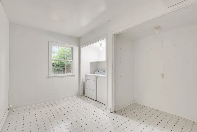 a room with a window and a sink