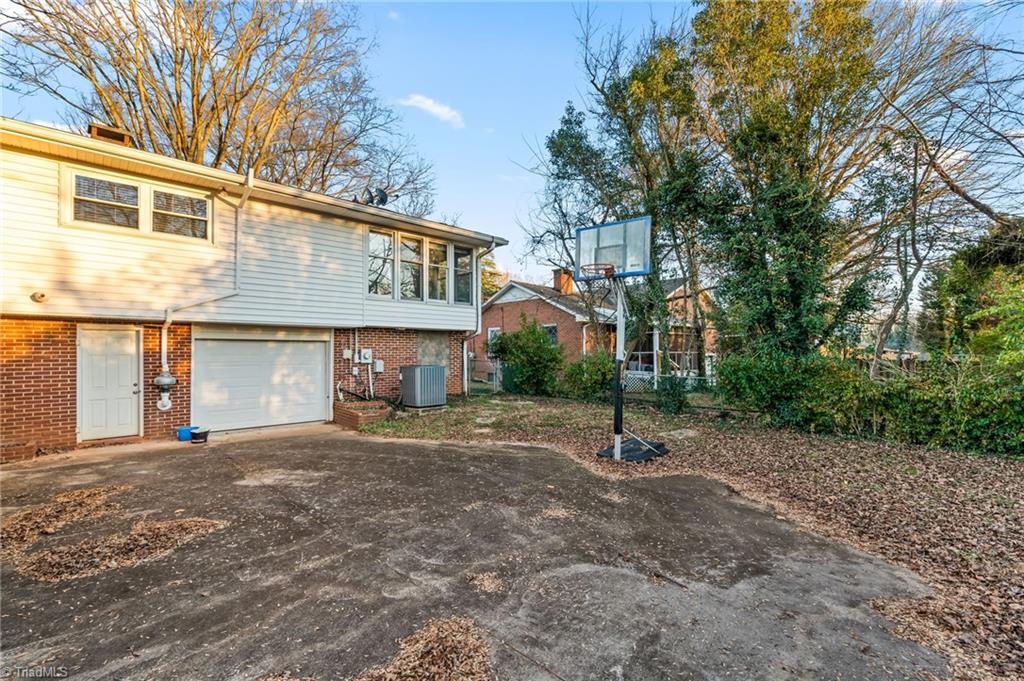 1430 Eldorada Road Winston-Salem, NC 27103 - Photo 45 of 45 Driveway to garage and fenced back yard.