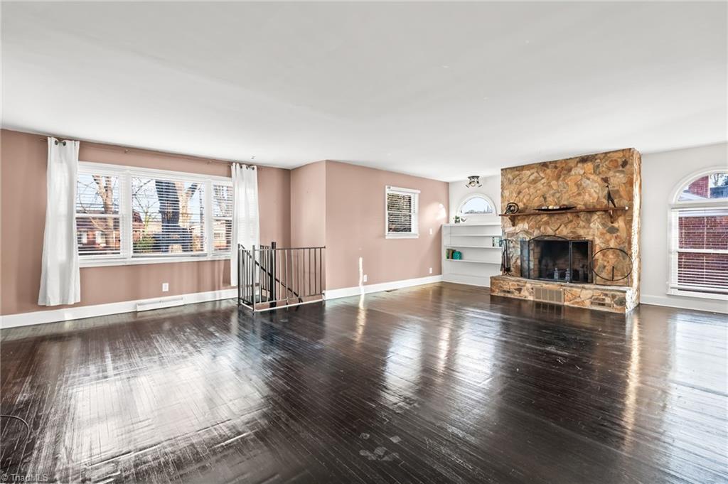 1430 Eldorada Road Winston-Salem, NC 27103 - Photo 6 of 45 Huge living room with spiral staircase to private 4th bedroom.