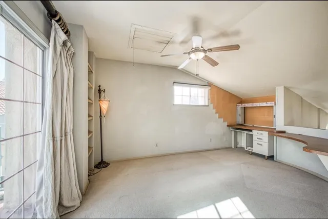 a view of a kitchen with a sink and cabinet area