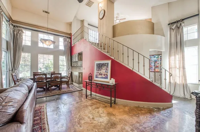 a living room with furniture and windows