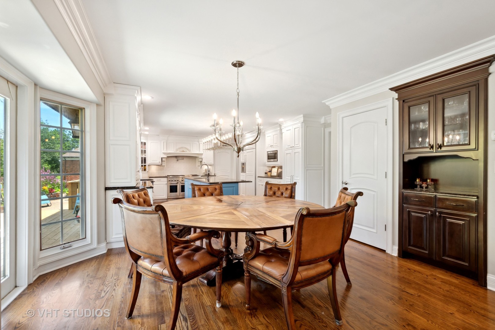 562 A Aberdeen Road Frankfort, IL 60423 - Photo 11 of 47 a dining room with furniture a chandelier and wooden floor