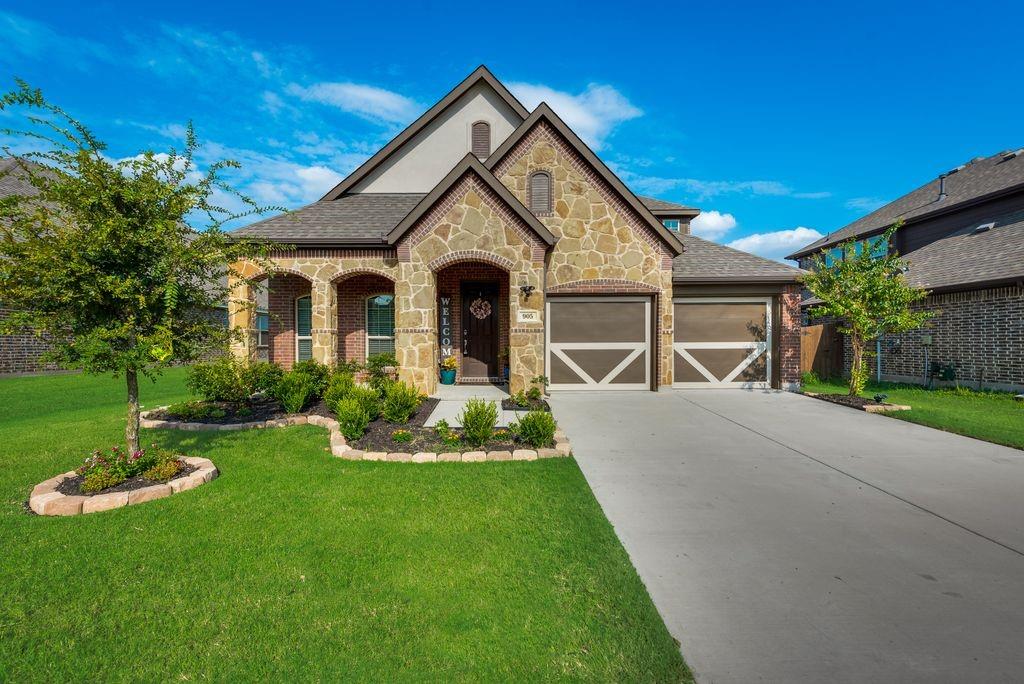905 Smotherman Farm Road Little Elm, TX 75068 - Photo 1 of 1 a front view of a house with a yard and porch