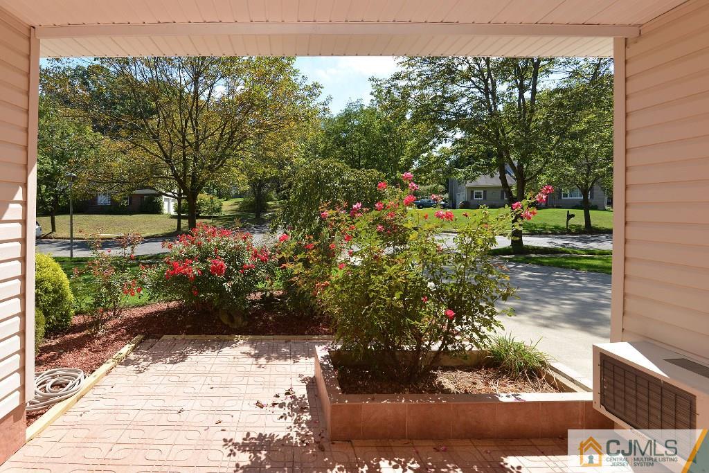 27 Thomas Road East Brunswick, NJ 08816 - Photo 2 of 24 a front view of a house with a yard