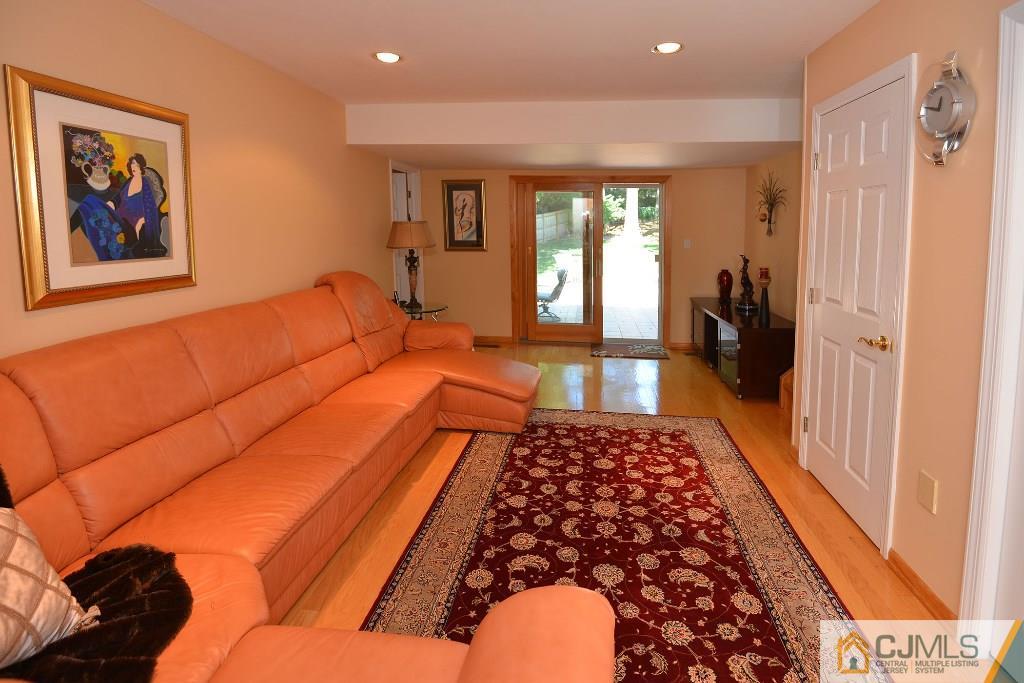 27 Thomas Road East Brunswick, NJ 08816 - Photo 11 of 24 a bedroom with furniture and a rug