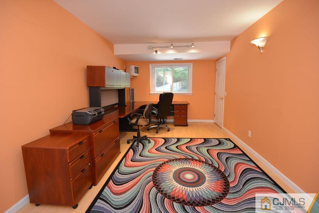 27 Thomas Road East Brunswick, NJ 08816 - Photo 18 of 24 a view of a room with gym equipment