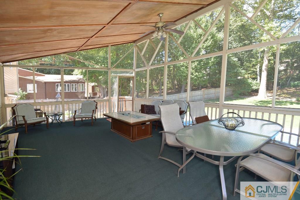 27 Thomas Road East Brunswick, NJ 08816 - Photo 21 of 24 a balcony with furniture and a garden