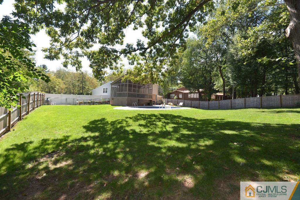27 Thomas Road East Brunswick, NJ 08816 - Photo 24 of 24 a view of a park with large trees