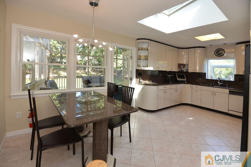 27 Thomas Road East Brunswick, NJ 08816 - Photo 8 of 24 a view of a dining room with furniture window and outside view
