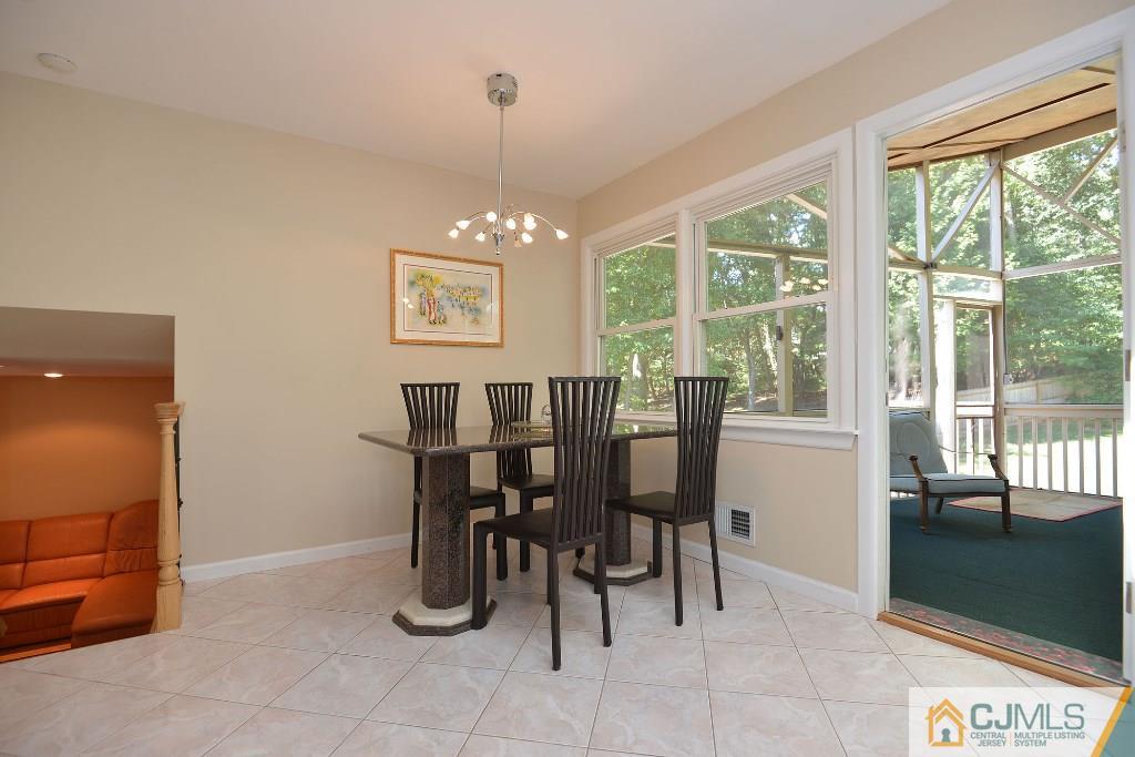 27 Thomas Road East Brunswick, NJ 08816 - Photo 10 of 24 a dining room with furniture and window