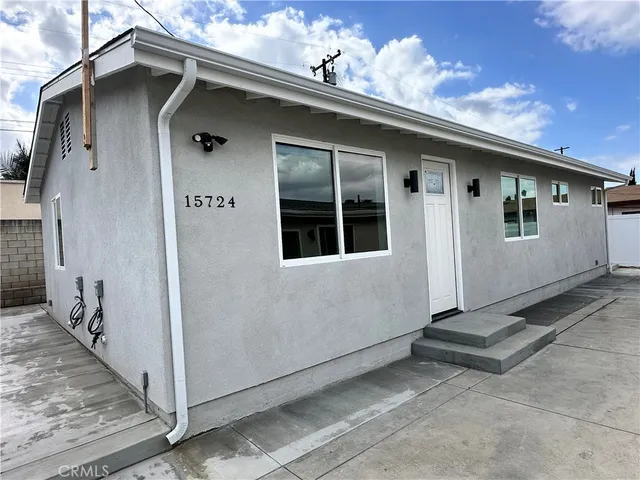 a front view of a house with garage