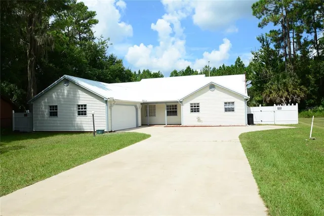 a view of a backyard of the house