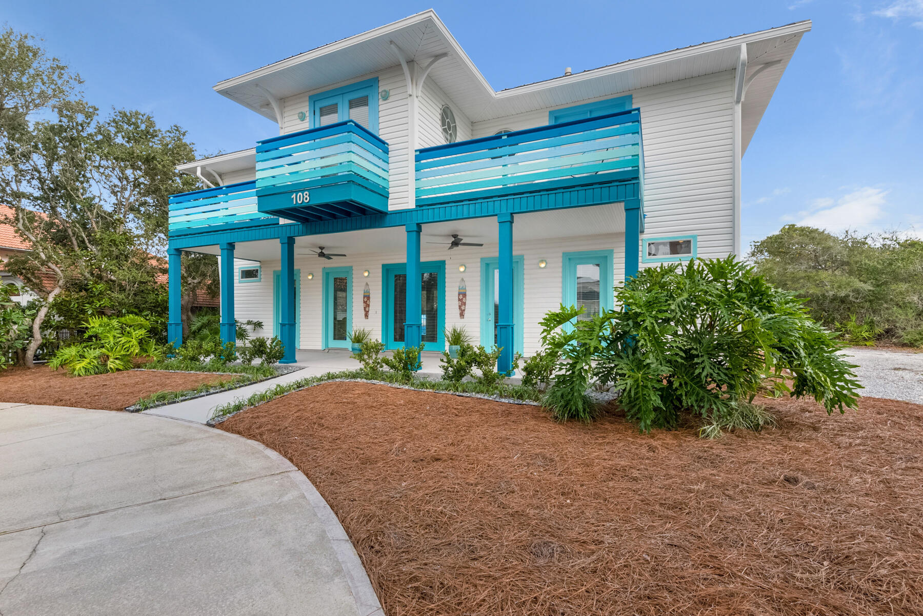 108 Pelican Circle Inlet Beach, FL 32461 - Photo 1 of 75 a front view of a house with garden