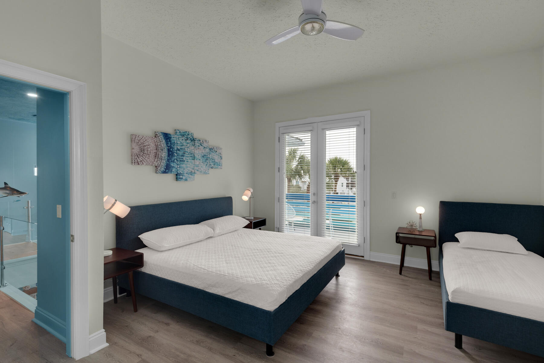 108 Pelican Circle Inlet Beach, FL 32461 - Photo 20 of 75 a bedroom with a bed a lamp and window