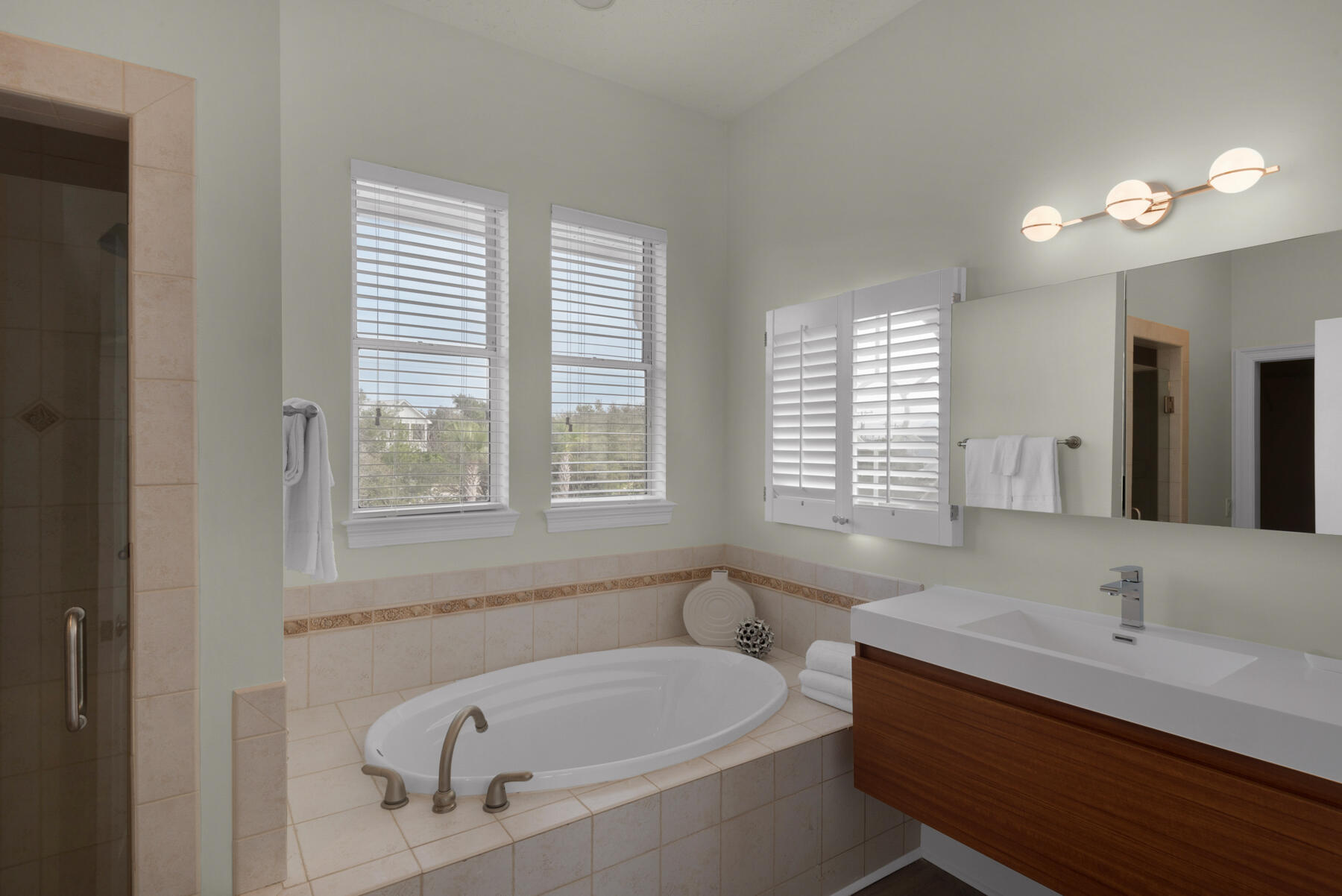 108 Pelican Circle Inlet Beach, FL 32461 - Photo 23 of 75 a bathroom with a tub a sink and a window