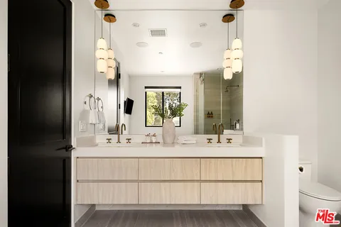 a bathroom with a sink and a shower