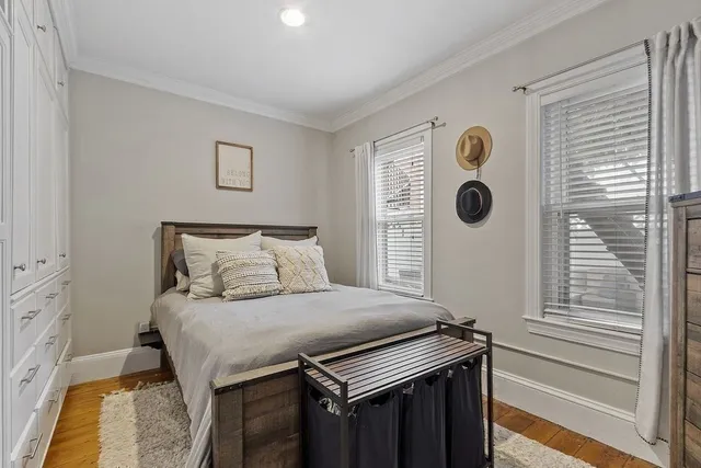 a bedroom with a bed and cabinets