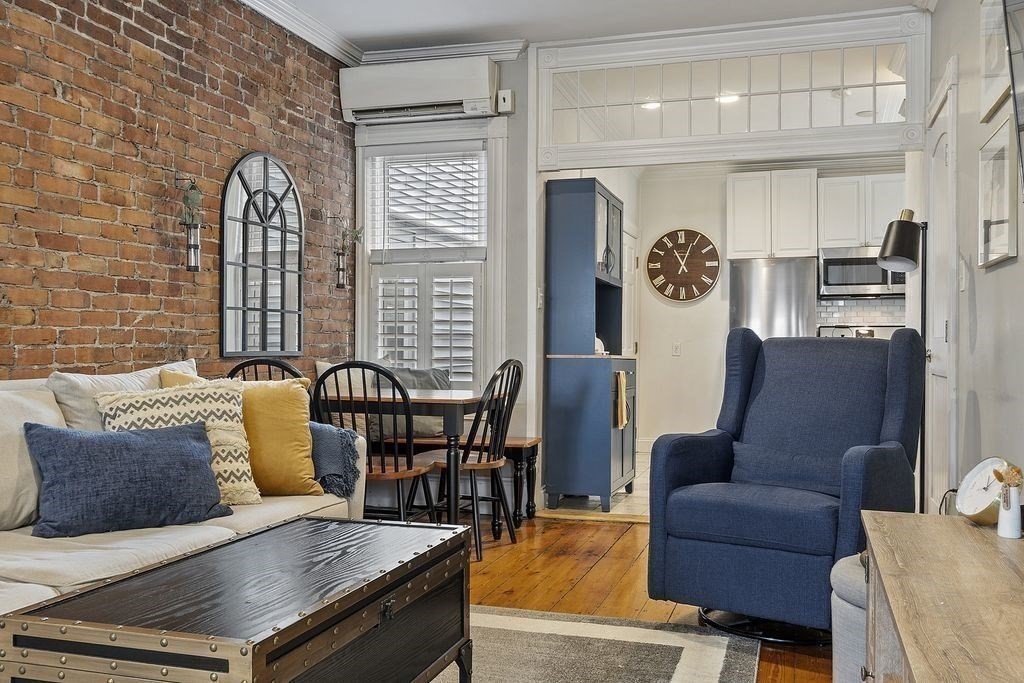 192 West Fifth Street, Unit 1 Boston, MA 02127 - Photo 3 of 24 a living room with furniture and wooden floor