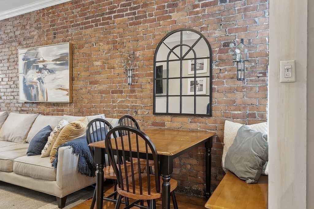 192 West Fifth Street, Unit 1 Boston, MA 02127 - Photo 8 of 24 a view of a balcony dining table and chairs