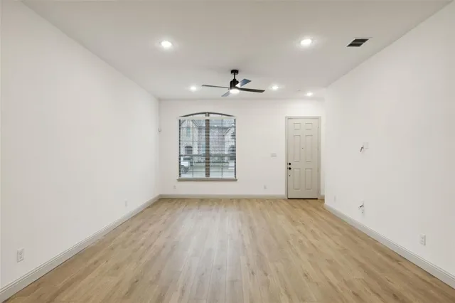 a kitchen with stainless steel appliances a sink a stove a refrigerator and cabinets